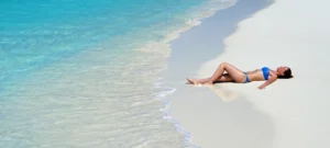 a woman is resting at bora bora's beach