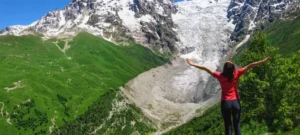 woman-wearing-red-shirt-standing-at-swis-alps. 
